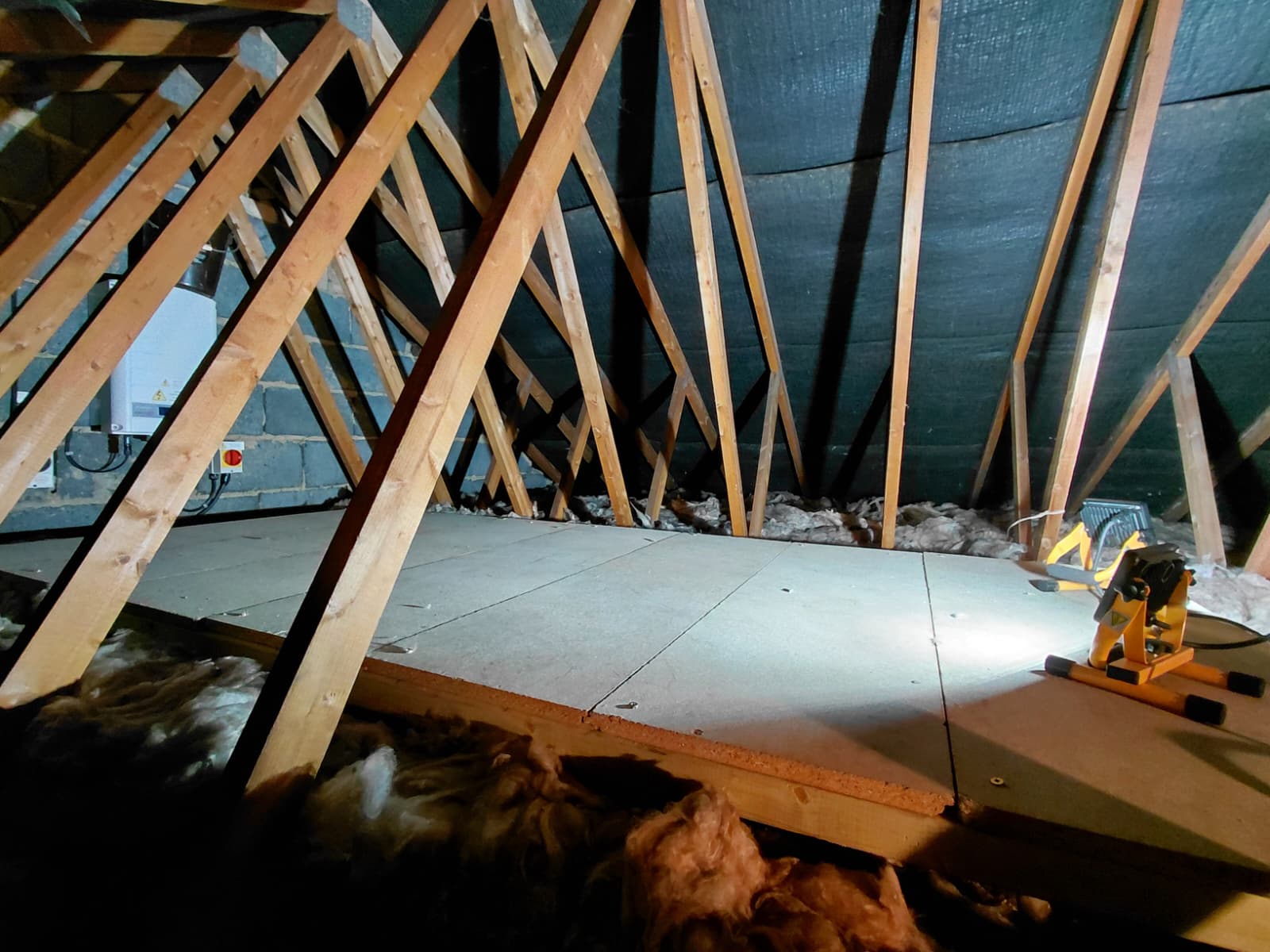 Raised loft boarding system installed above insulation